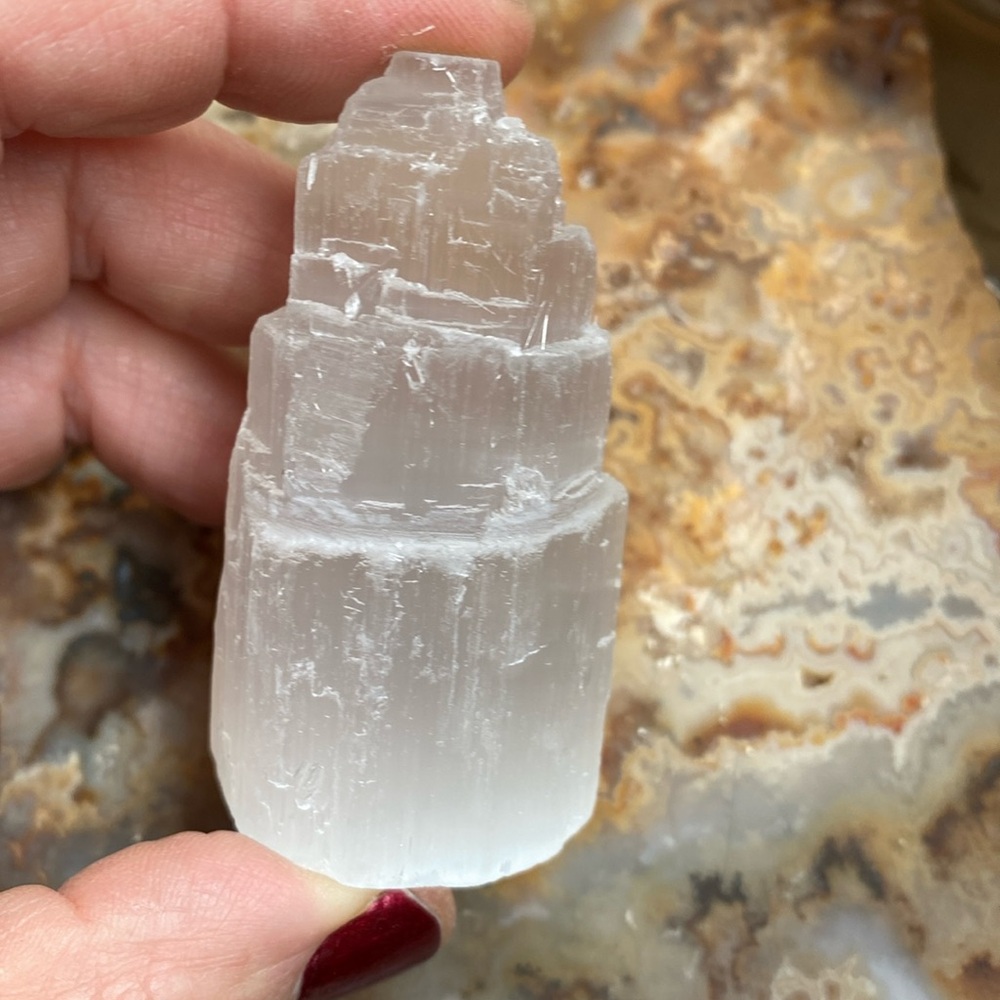 Bring in the light with this mini satin spar selenite Eiffel Tower